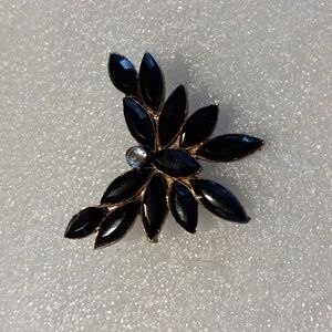 Gold Tone and black glass brooch